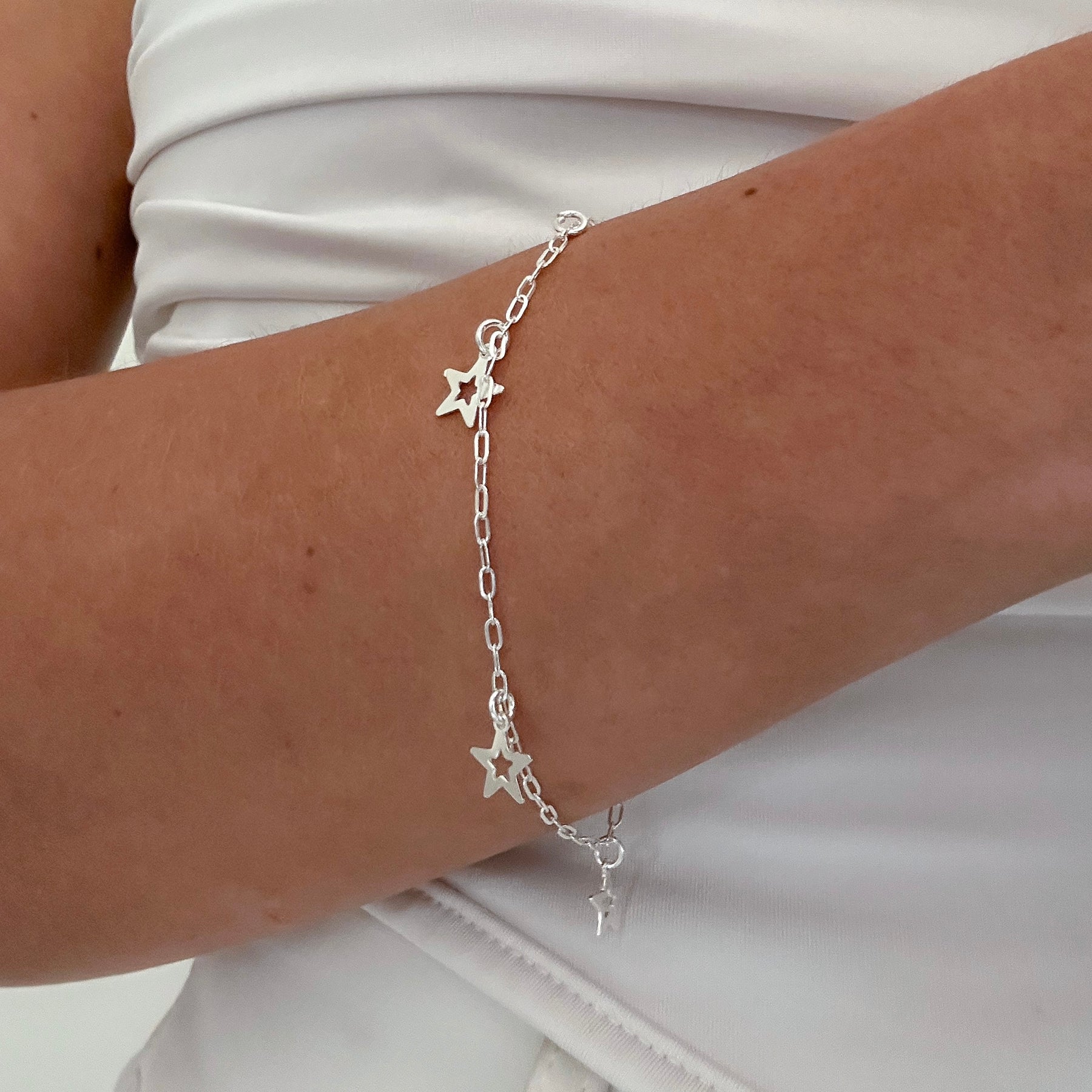 PULSEIRA ESTRELAS PENDENTES 18,5CM
